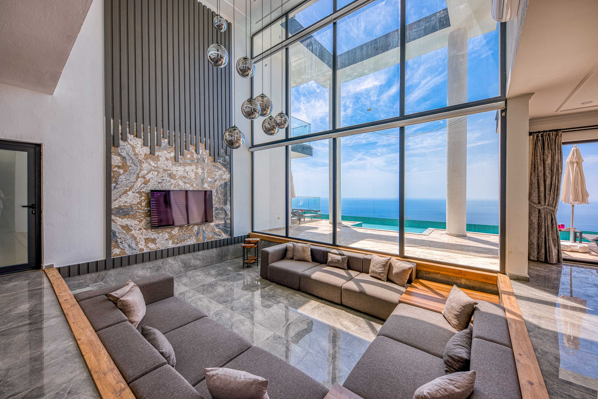Double-height living room with ocean view