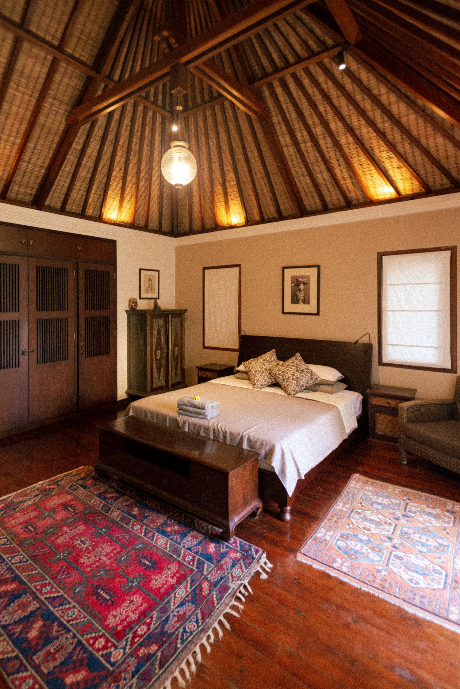 Master suite under a peaked island ceiling
